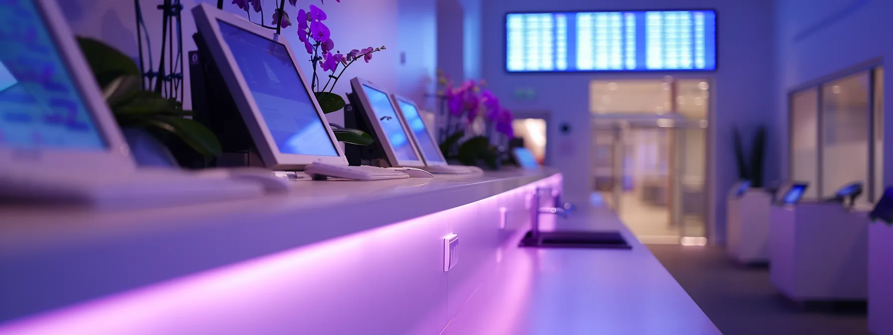 a sleek, modern hospital billing station bathed in soft, ambient lighting, featuring advanced medical billing software on vibrant screens displaying real-time analytics, symbolizing the seamless efficiency of automated payment systems.